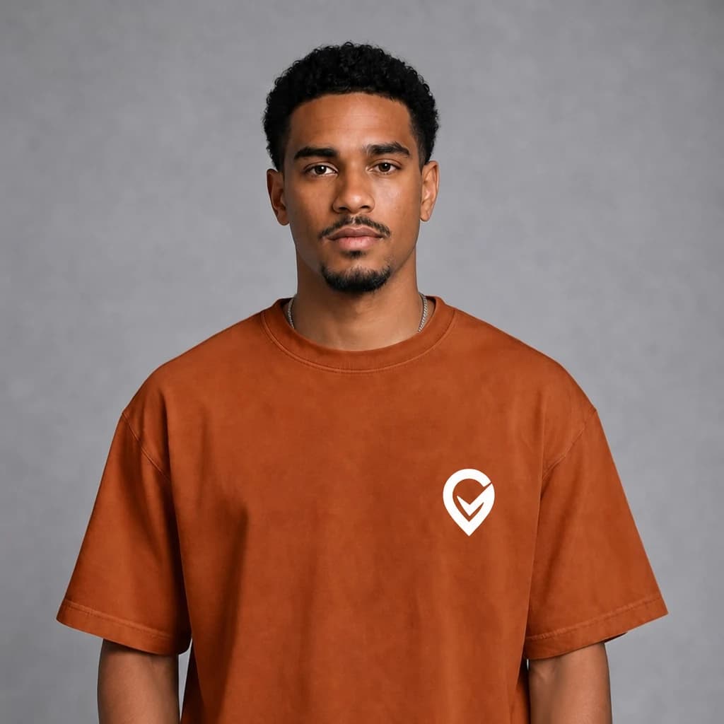 A man wearing an orange Trurep shirt with the white logo